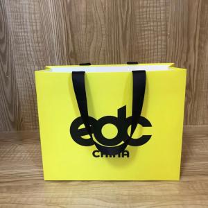 China 175gsm Lotus Color Goose Yellow Garment Paper Bags For Clothing Store factory