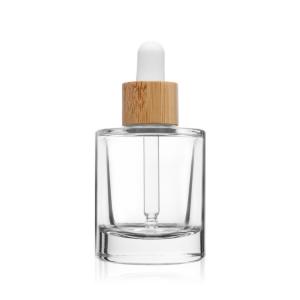 China Face Cosmetic Packaging Clear Glass Serum Dropper Bottle With Bamboo Lid on sale