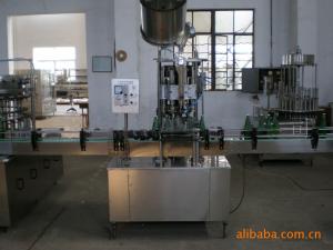 China Automatic glass bottle crown caps capping machine / beer bottle cap sealing machine factory