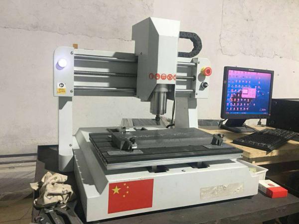 China Small 800w Desktop CNC Router Machine Engraving Wood Stone Acrylic And Soft Metal factory