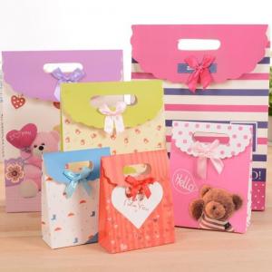 China Customized pattern Cardboard Gift Bags 24x10x32cm With Handle Bow Knot on sale
